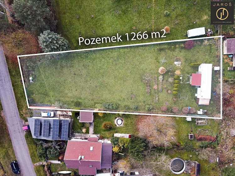 Prodej stavebního pozemku 1 266 m² - foto 1