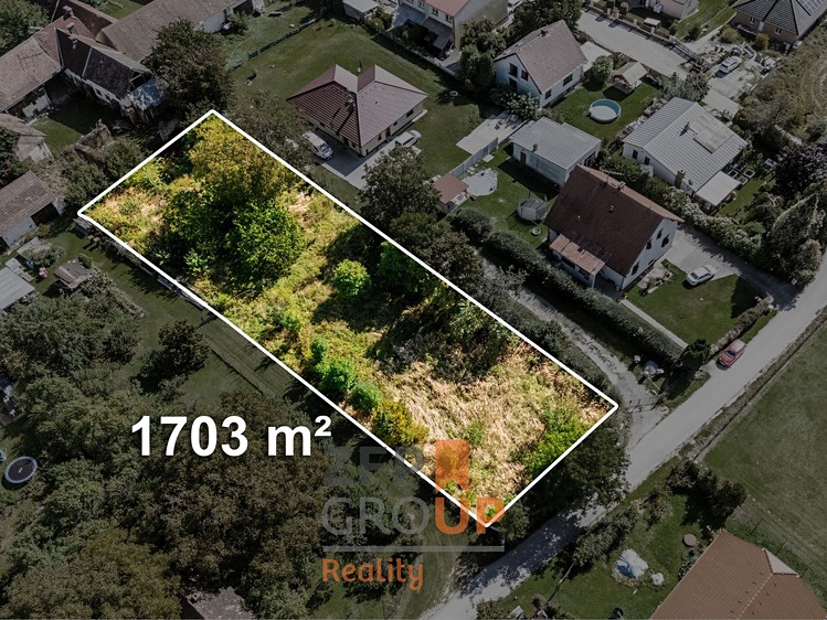 Prodej stavebního pozemku 1 703 m² - foto 1
